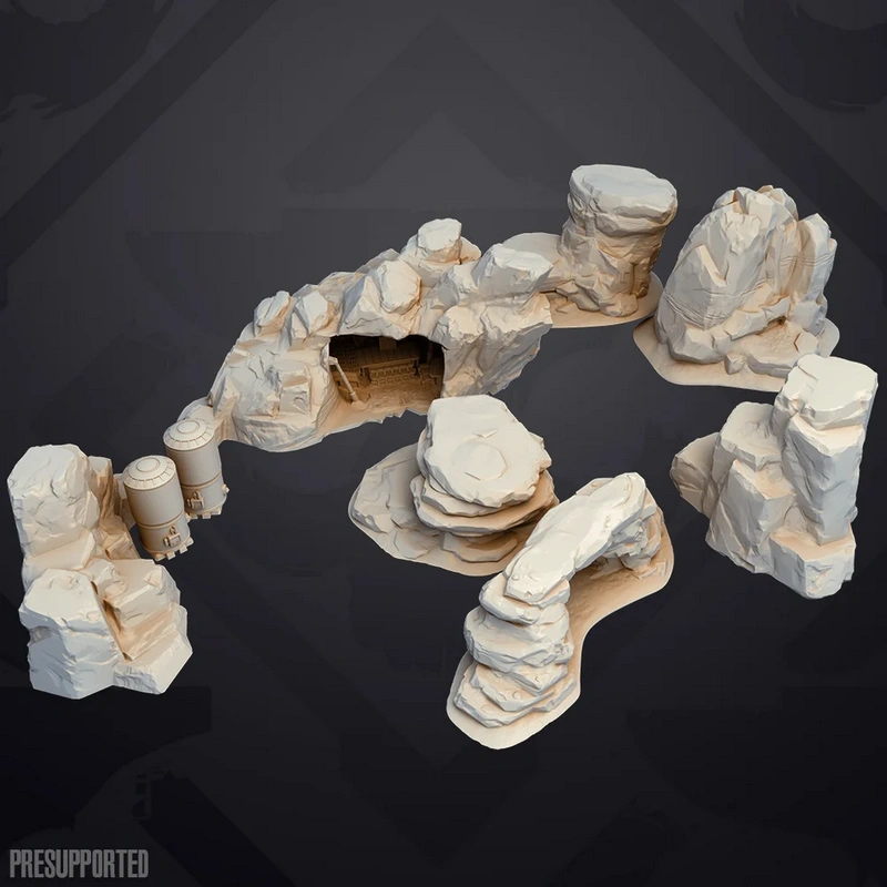 Rocky Star Wars badlands hideout terrain with cave, cliffs, and cylindrical details