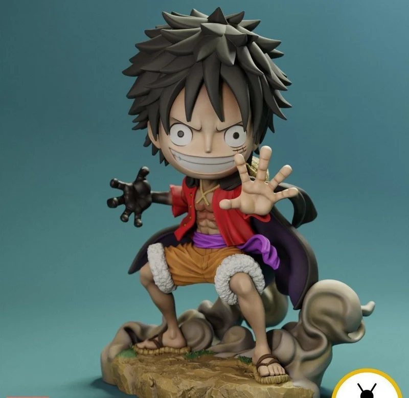 Luffy from One Piece in a crouching pose on a rocky display base