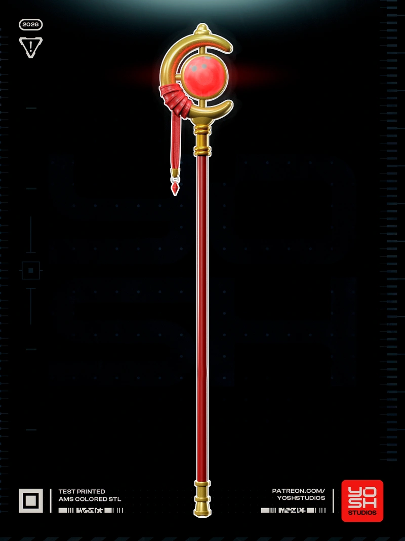 Frieren’s magical staff with a red orb, gold crescent frame, red shaft, and hanging charm
