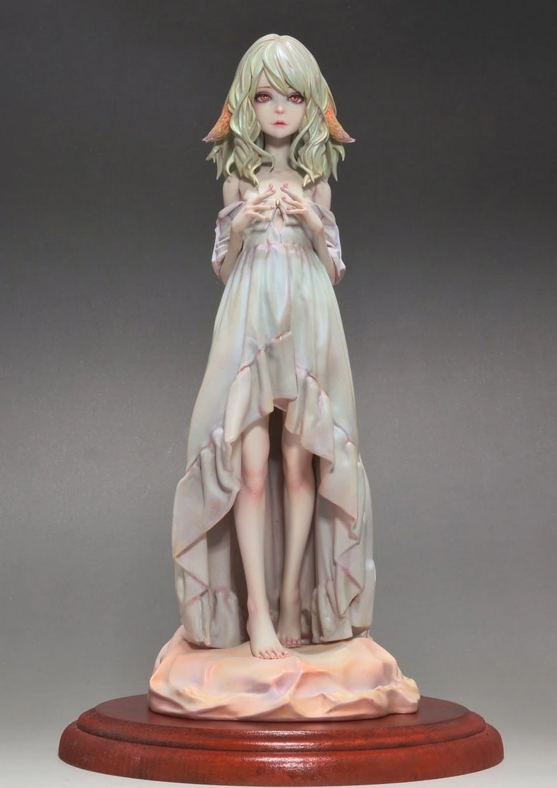 Actres fantasy character statue with pointed ears, pale hair, flowing dress, and display base