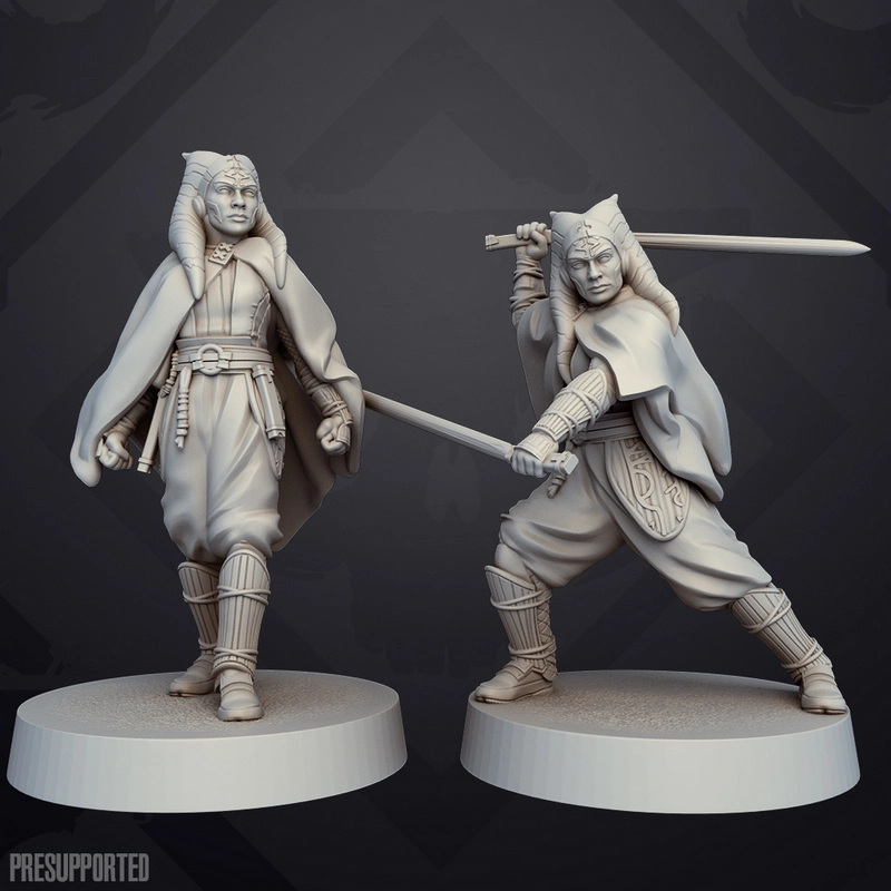 Two Ahsoka Tano Star Wars statues with lightsabers on round display bases