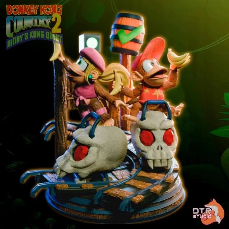 Donkey Kong game diorama with monkey characters, skull vehicles, rails, and a striped barrel