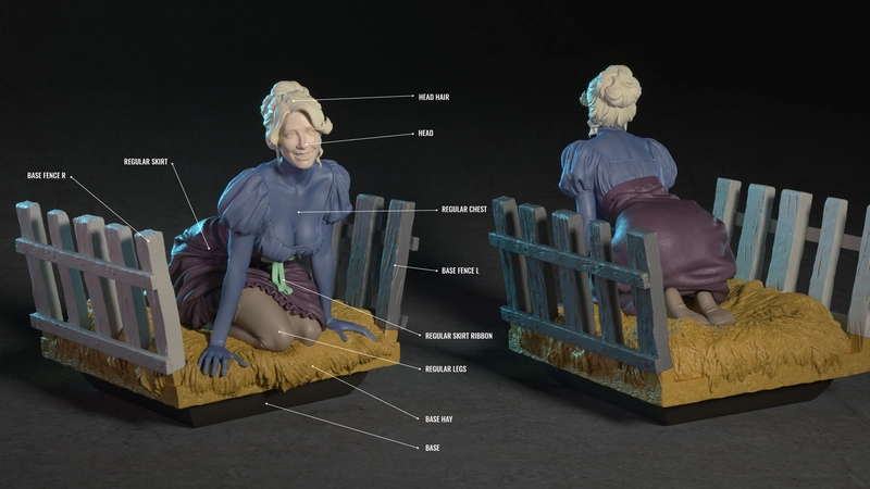 Inga Young Frankenstein figure seated on a hay bed inside a rustic slatted fence