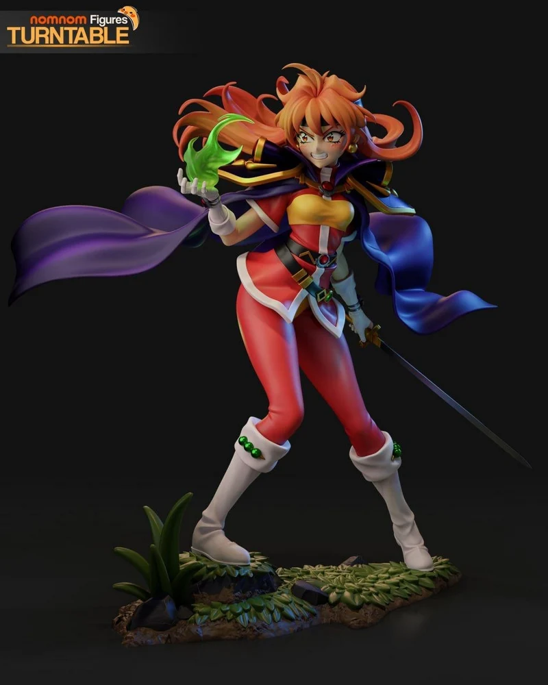 Lina Inverse from Slayers with green magic, flowing cape, sword, and scenic display base