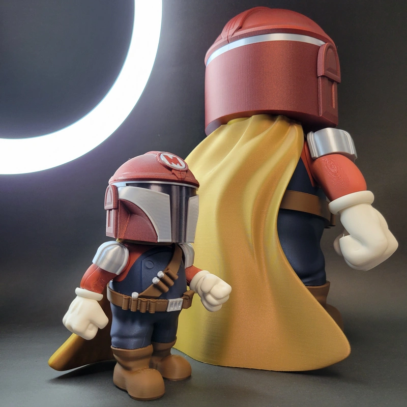 Two Mario-inspired figures wearing Mandalorian-style helmets, armor, and capes