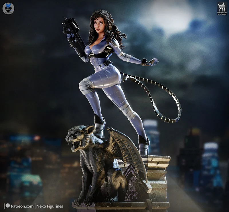 Catwoman DC Comics figurine in silver catsuit with whip and feline pedestal