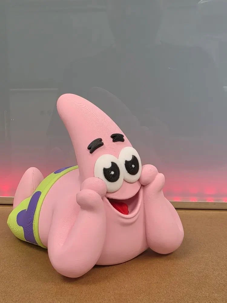 Patrick Star 3D model posed on his belly with wide eyes and colorful swim trunks
