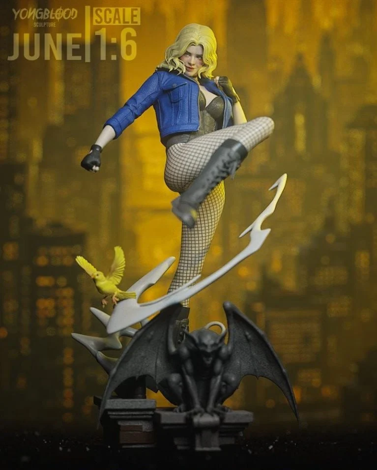 Black Canary statue in a blue jacket and fishnet tights on a gargoyle base