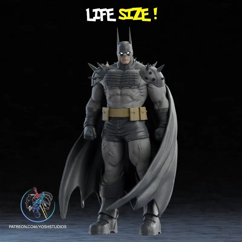 Life-size Absolute Batman statue in a spiked armored suit with a sweeping cape