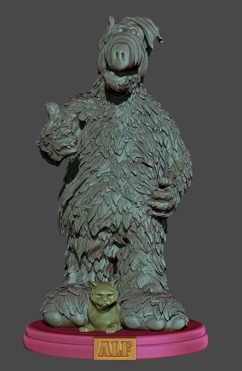 ALF furry alien statue with cat companion on a pink labeled pedestal