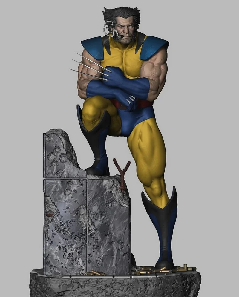 Wolverine Marvel statue in yellow and blue suit with claws on a rocky base