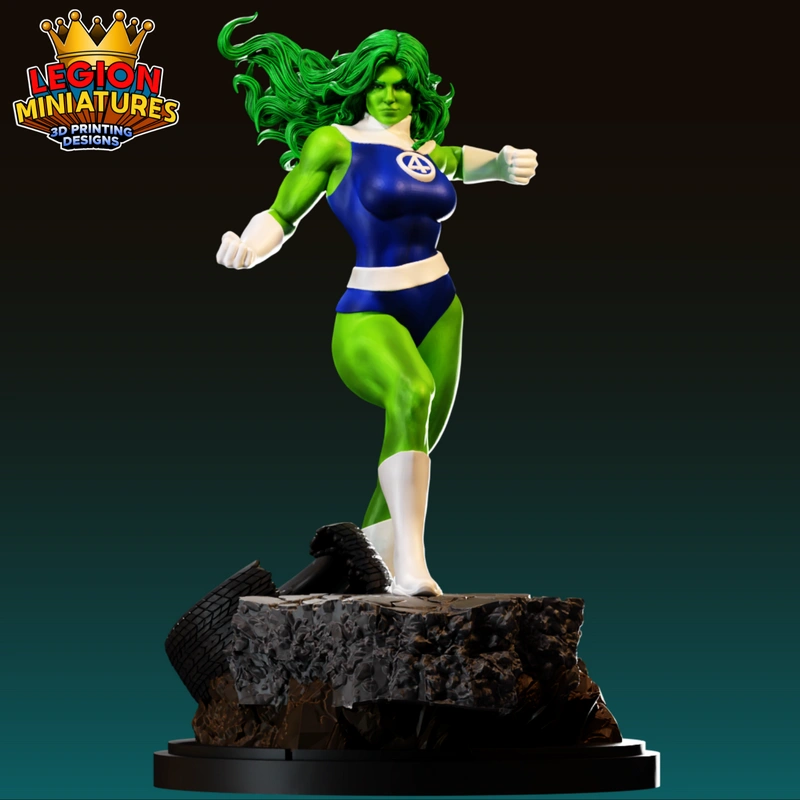 She-Hulk statue with green skin, flowing hair, blue costume, and rocky base
