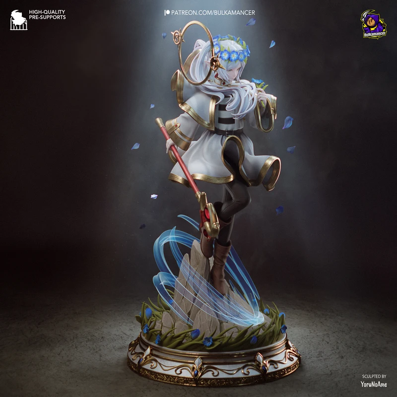 Frieren statue with staff, blue flowers, flowing effects, and ornate display base