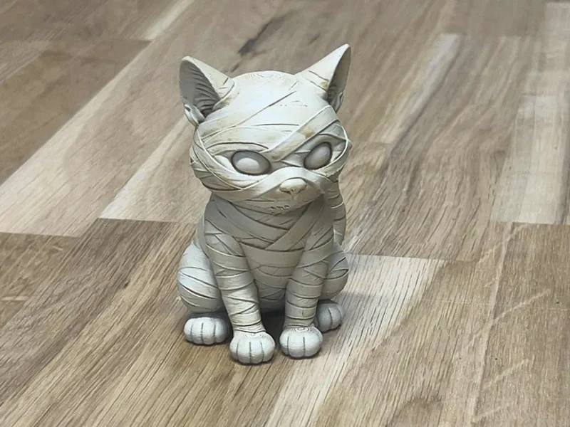 Seated mummy cat 3D model with bandages, pointed ears, and large oval eyes
