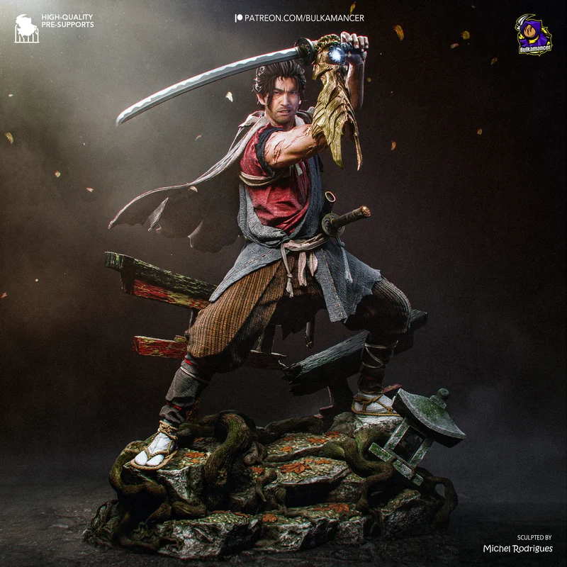 Miyamoto Musashi samurai statue raising a katana on a rocky base